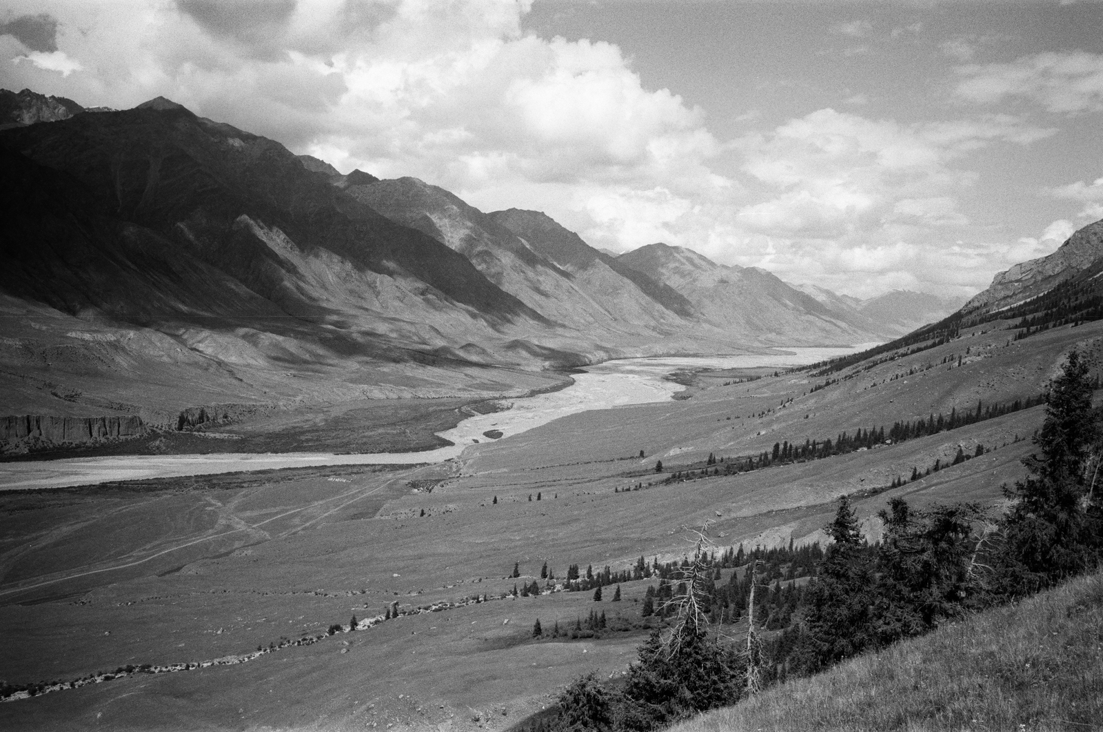 black and white river valley in the mountains