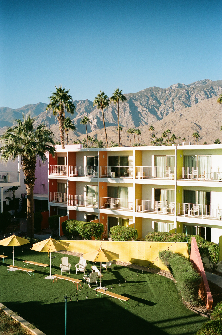 palm springs motel lawn beneath mountain light
