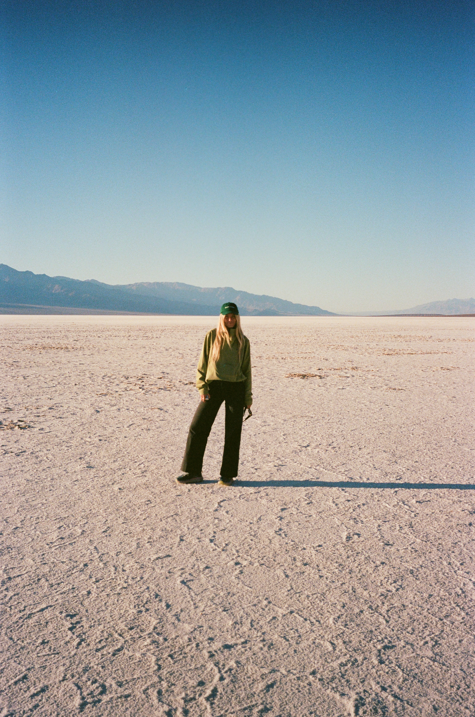 single figure standing on a bright salt flat